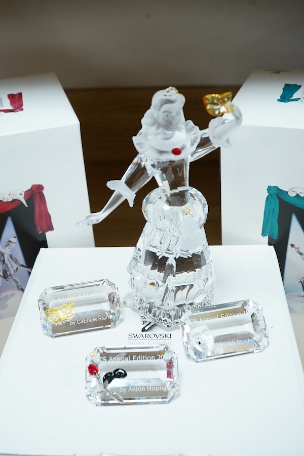 Three Swarovski ‘Masquerade’ figures, Pierrot, Harlequin and Columbine, two with original boxes, all three with stands, together with a cased Swarovski ballerina, Columbine 17cm high. Condition - good